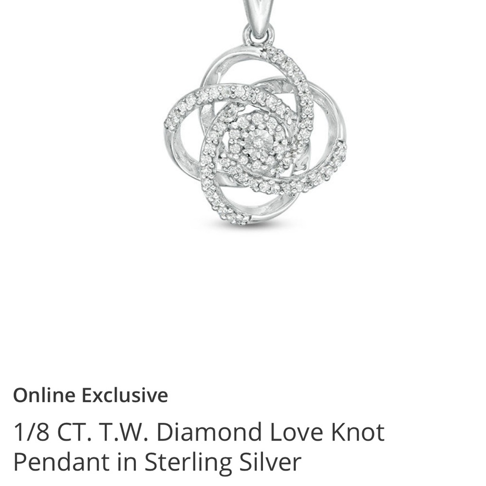 1/8 CT. T.W. Diamond Love Knot Pendant in Sterling Silver